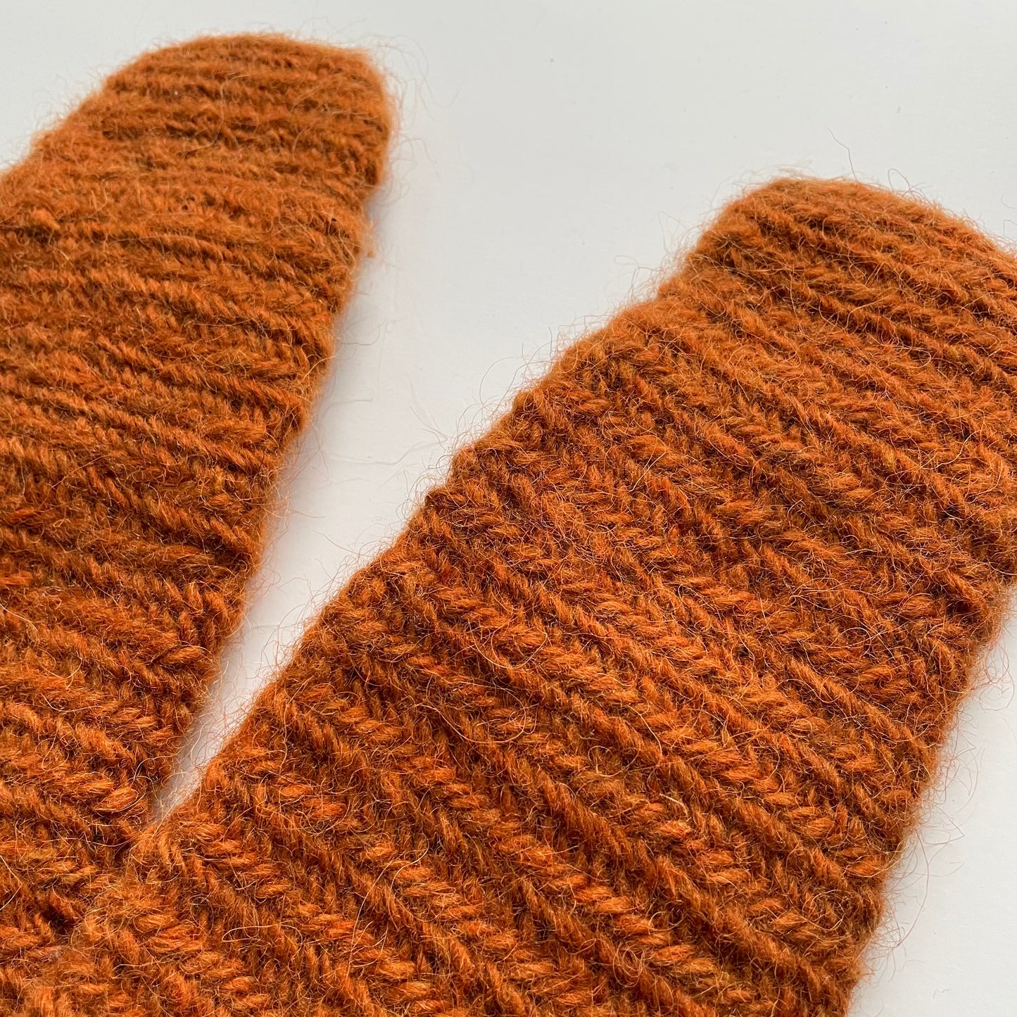 Needle-tied wool mittens, orange