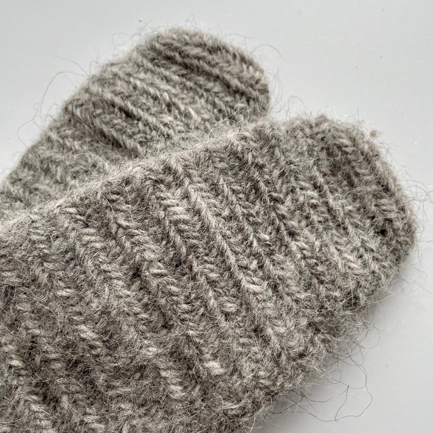 Needle-tied wool mittens, grey