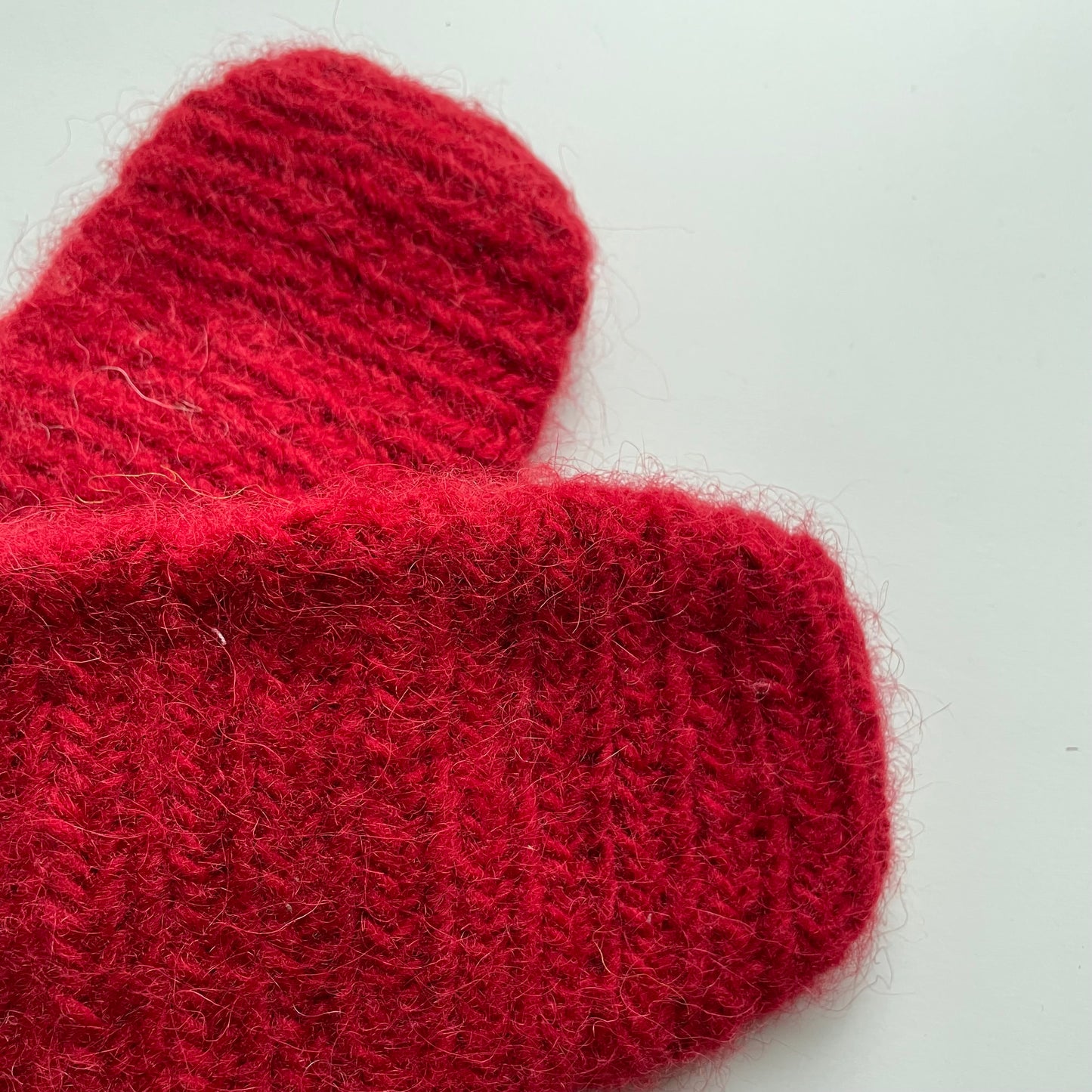 Needle-tied wool mittens, red