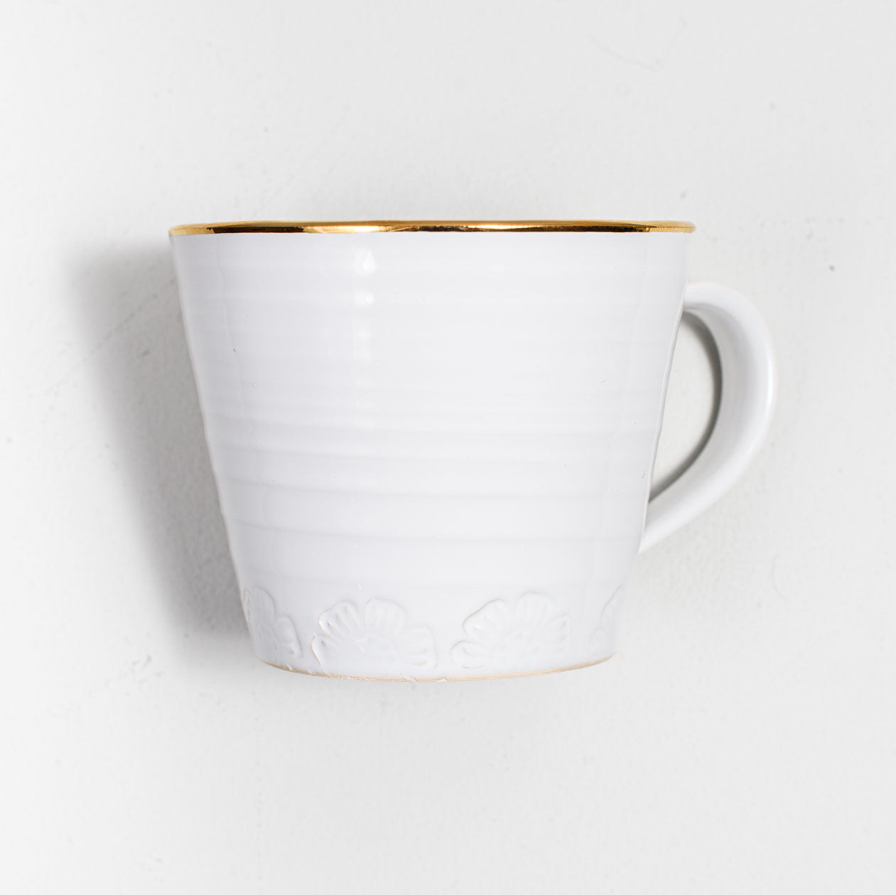 Kaffekopp med guldkant i lergods